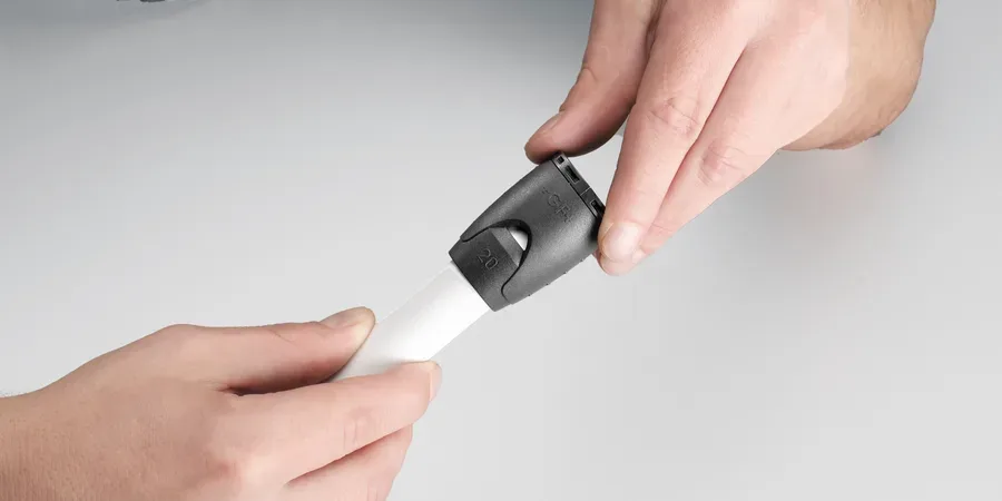 Adapter being pushed onto the prepared pipe end